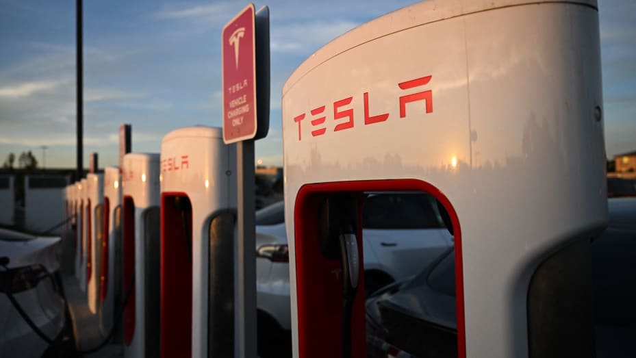 A Tesla, Inc. electric vehicle charges at supercharger location in Hawthorne, California, on August 9, 2022.