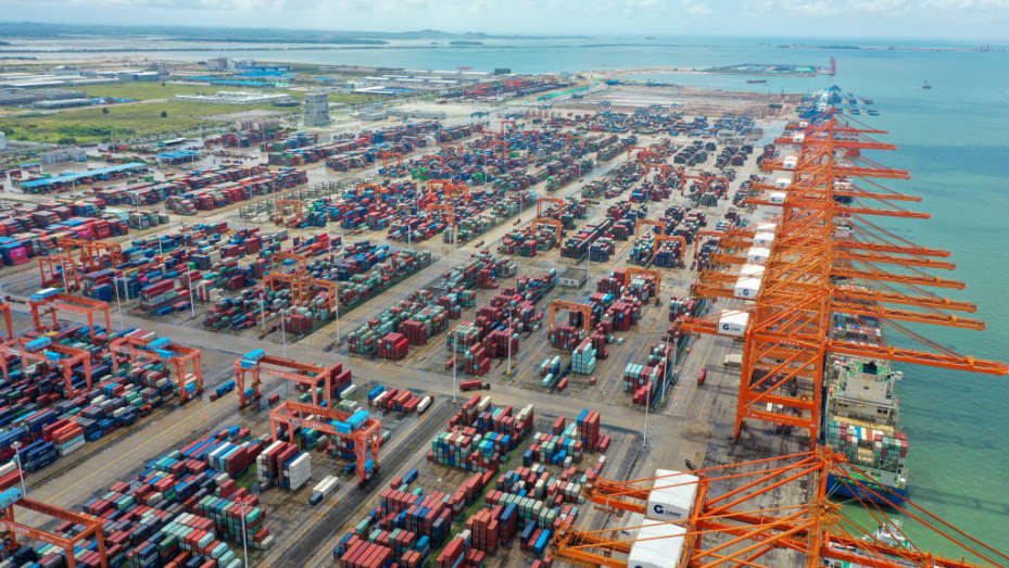 Aerial view of containers sitting stacked at the Qinzhou Port on August 15, 2022 in Qinzhou, Guangxi Zhuang Autonomous Region of China.