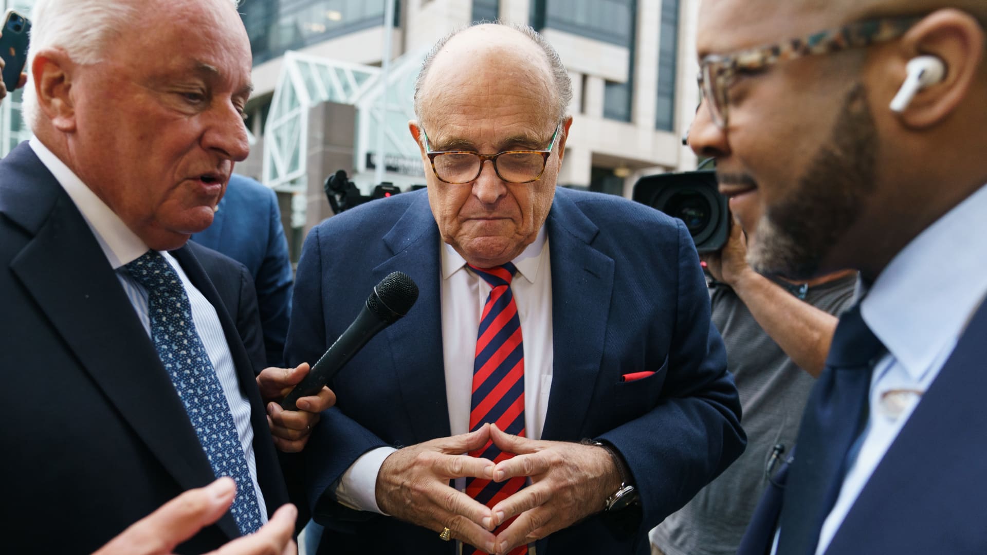 Rudy Giuliani, former lawyer to Donald Trump, his attorney Robert Costello, left, and Vernon Jones, former Republican Representative candidate for Georgia, right, arrive at Fulton County Superior Court in Atlanta, Georgia, US, on Wednesday, Aug. 17, 2022.