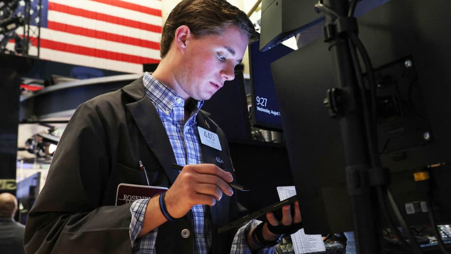 Traders work on the floor of the New York Stock Exchange (NYSE), August 17, 2022.