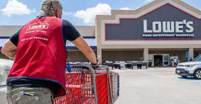 Lowe's cuts full-year sales forecast, as it tops earnings and revenue estimates