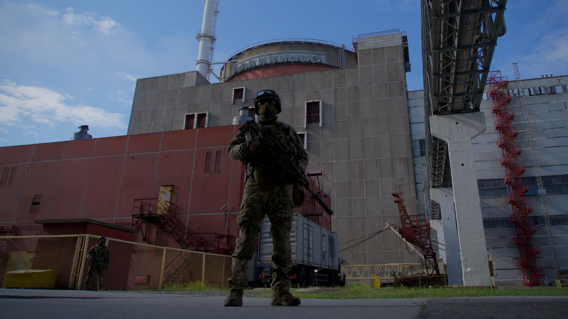 A Russian serviceman stands guard the territory outside the second reactor of the Zaporizhzhia Nuclear Power Station in Energodar on May 1, 2022.