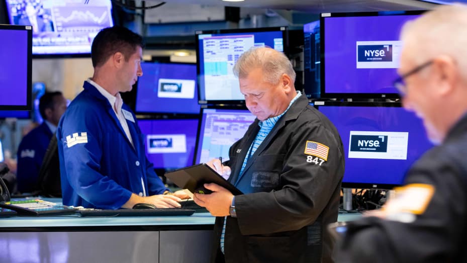 Traders work on the floor of the New York Stock Exchange. 