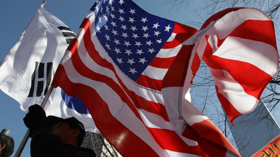 The United States and the South Korean flags are waved on March 10, 2015 in Seoul, South Korea. South Korea and the United States began their largest joint military drills in years on Monday with a resumption of field training, officials said, as the allies seek to tighten readiness over North Korea's potential weapons tests.