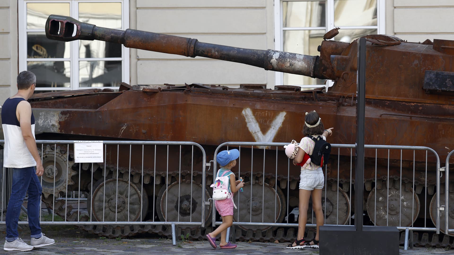Members of the public look around some destroyed Russian tanks in the city centre on August 22, 2022 in Lviv, Ukraine. 