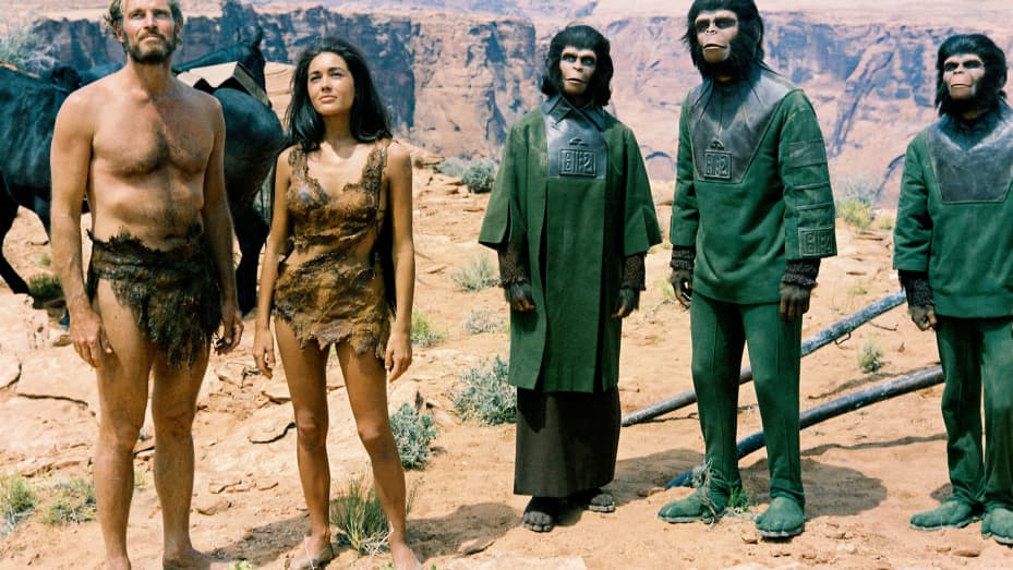 Charlton Heston and Linda Harrison, alongside Kim Hunter, Roddy McDowall dressed in ape costumes, in a publicity still issued for the film, 'Planet of the Apes', 1968. T(Photo by Silver Screen Collection/Getty Images)