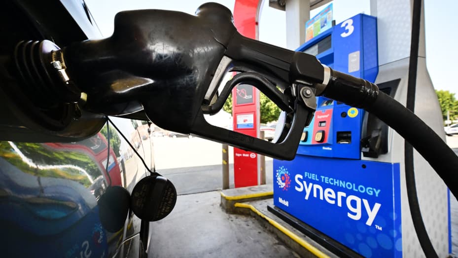 A gasoline nozzle pumps gas into a vehicle in Los Angeles, California on August 23, 2022.