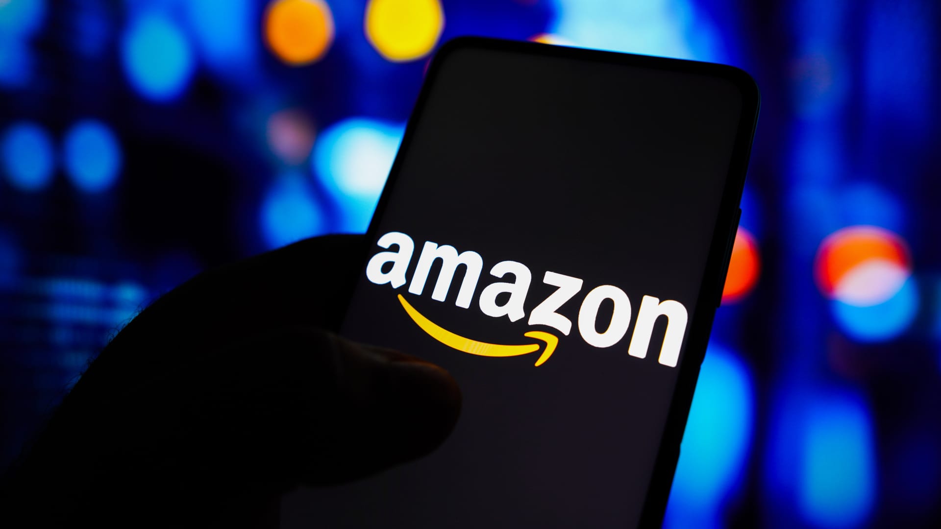 In this photo illustration, the Amazon logo is displayed on a smartphone screen.