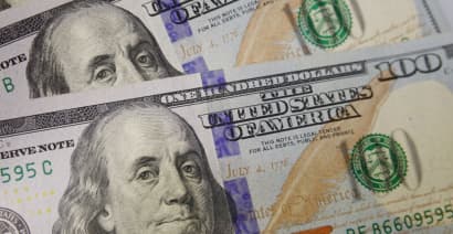 Dollar gains as Friday's losses seen overdone; Fed comments lend support 