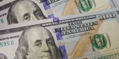 Dollar edges down but still close to 5½-month high