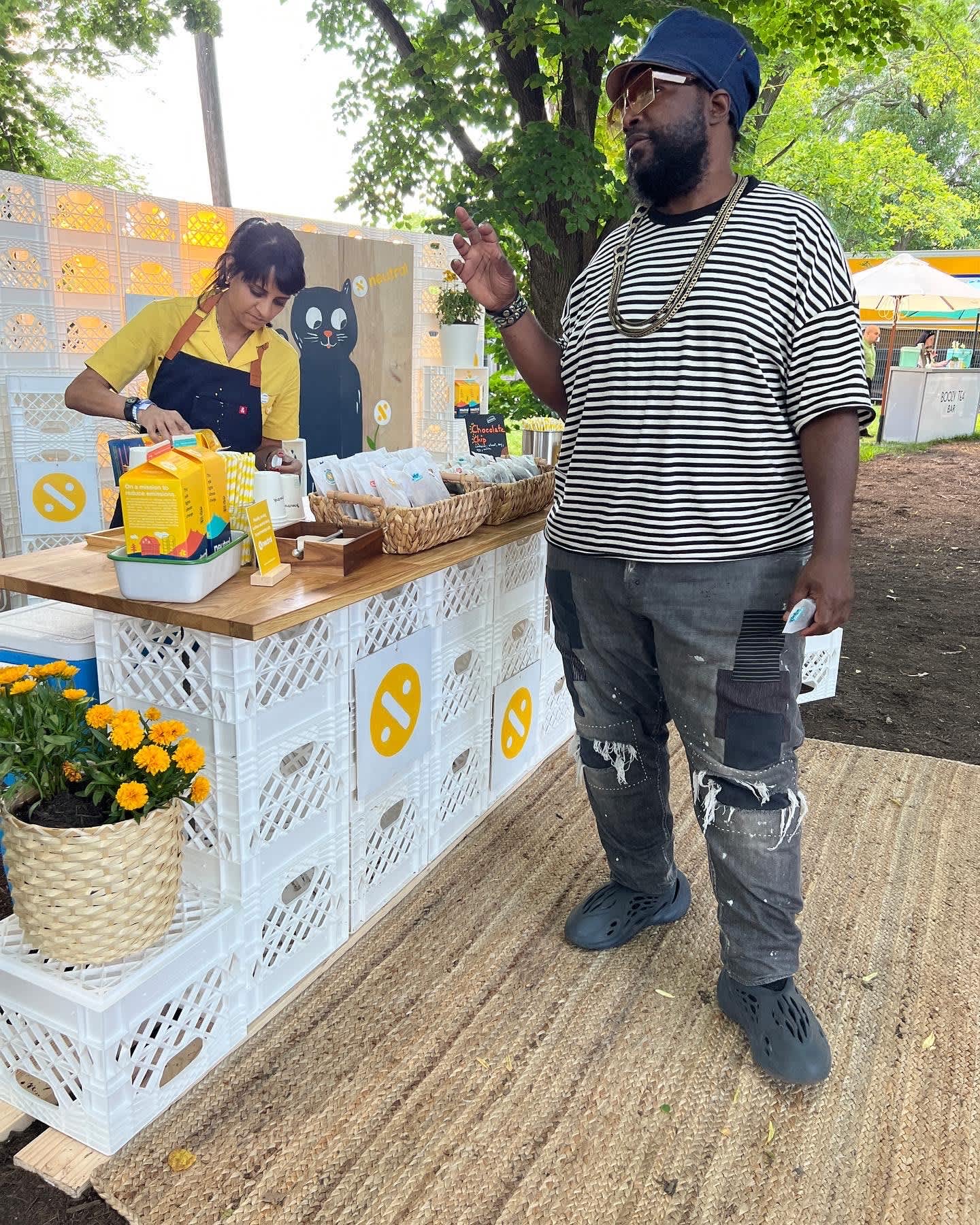 Kavita Patel, vice president of marketing at Neutral, seen pouring milk at a picnic with Questlove, an investor in the startup. This photo was taken in June in Philadelphia at the Roots picnic in Fairmount Park.