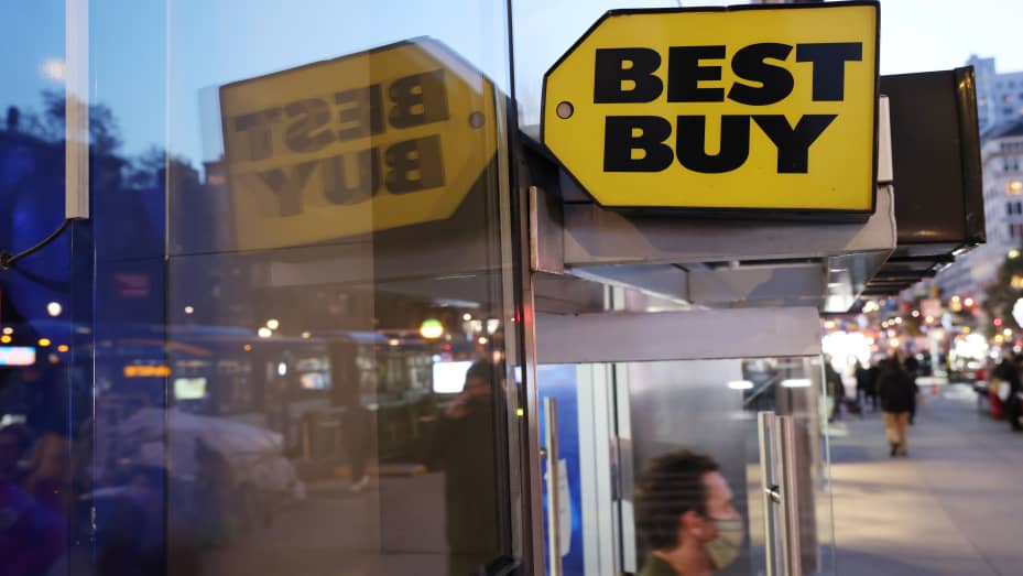 A person exits a Best Buy store in New York City.