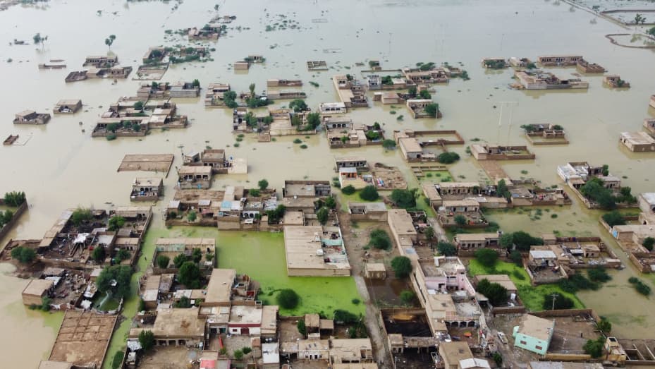 This aerial view shows a flooded residential area in Dera Allah Yar town after heavy monsoon rains in Jaffarabad district, Balochistan province on August 30, 2022.