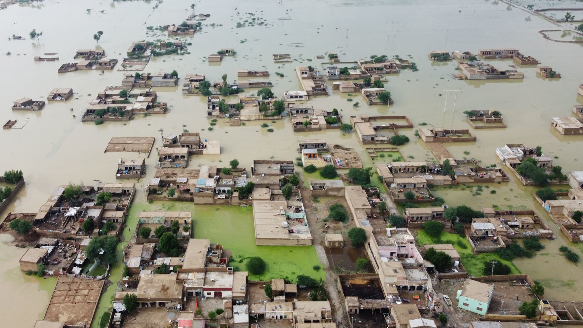 This aerial view shows a flooded residential area in Dera Allah Yar town after heavy monsoon rains in Jaffarabad district, Balochistan province on August 30, 2022.