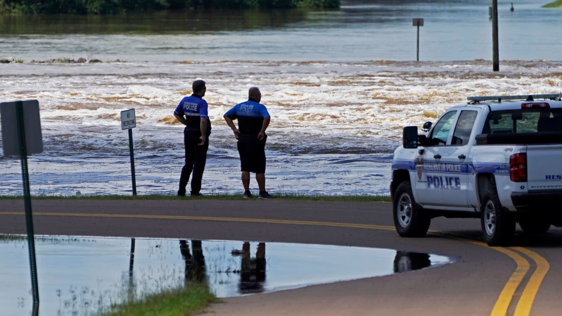 Reservoir police observe the water release from the Ross Barnett Reservoir Spillway onto the Pearl River, Sunday, Aug. 28, 2022, in Rankin County, Miss.