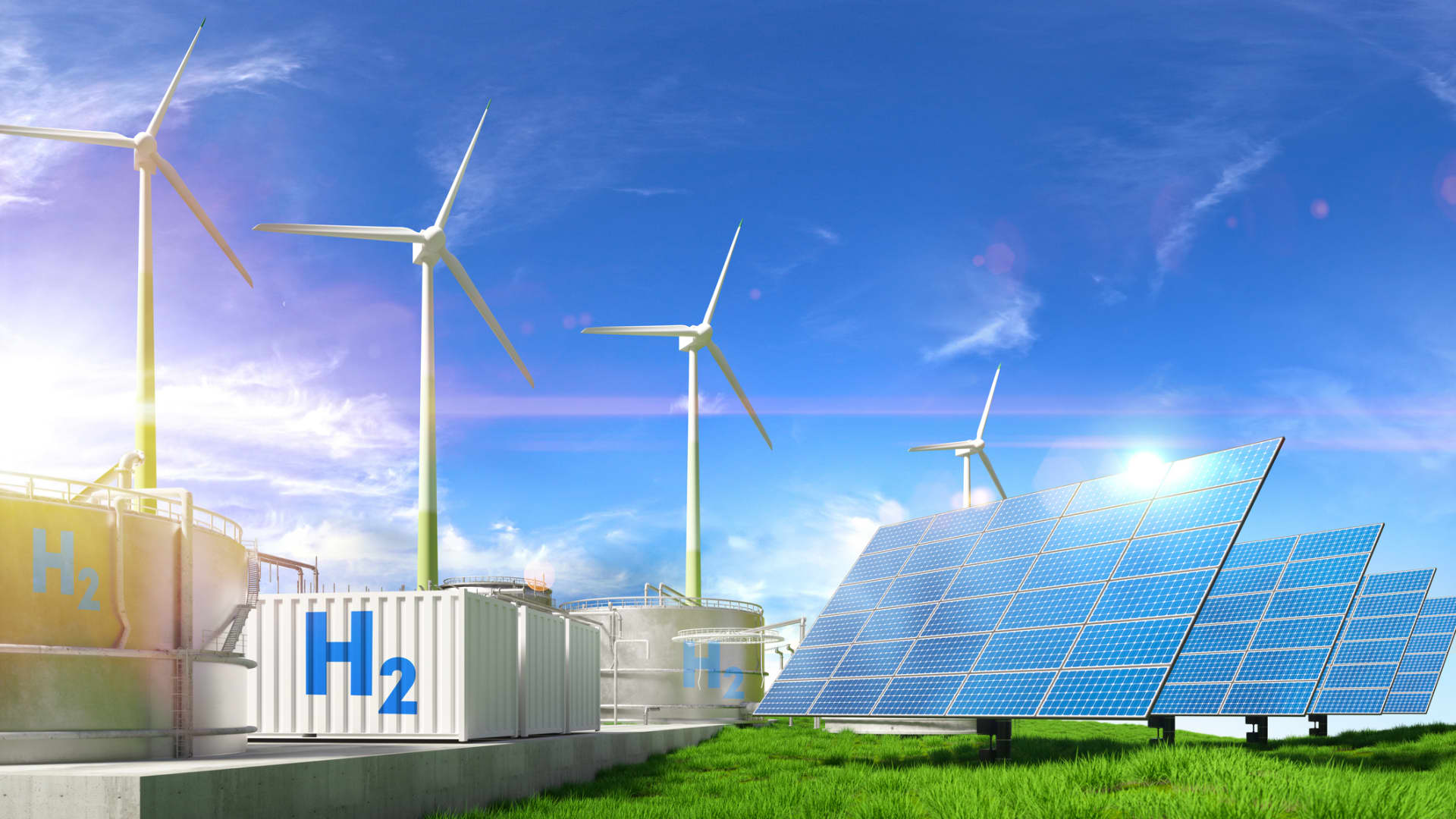 Digital generated image of wind turbines, solar panels and Hydrogen containers standing on landscape against blue sky.