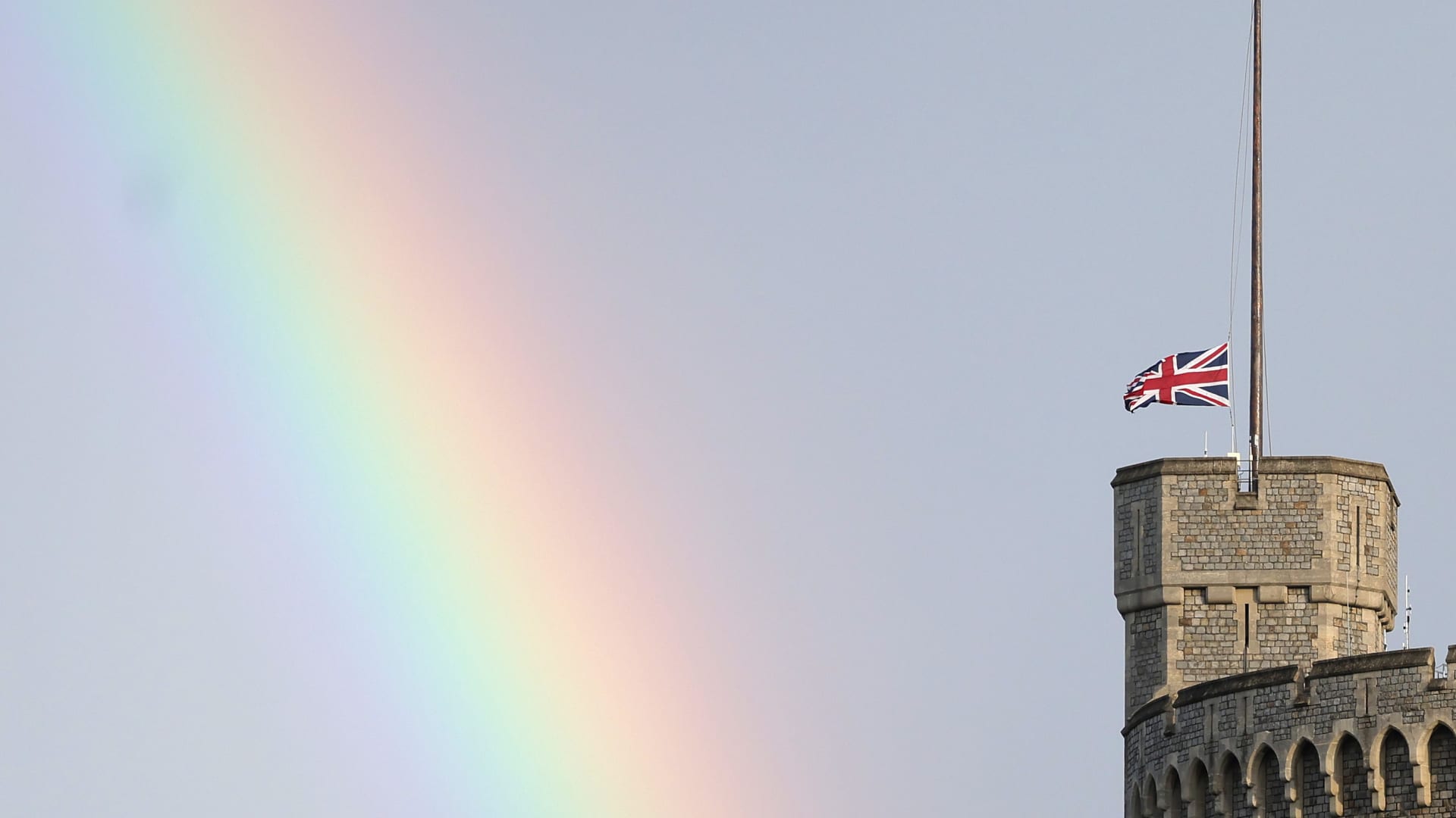The Union flag is lowered on Windsor Castle as a rainbow covers the sky on September 08, 2022 in Windsor, England. Elizabeth Alexandra Mary Windsor was born in Bruton Street, Mayfair, London on 21 April 1926.