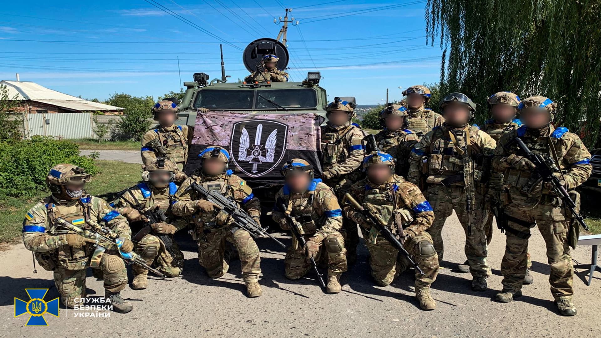 Service members of the State Security Service of Ukraine pose for a picture in the recently liberated town of Kupiansk in the Kharkiv region of Ukraine in this handout picture released Sept. 10, 2022.