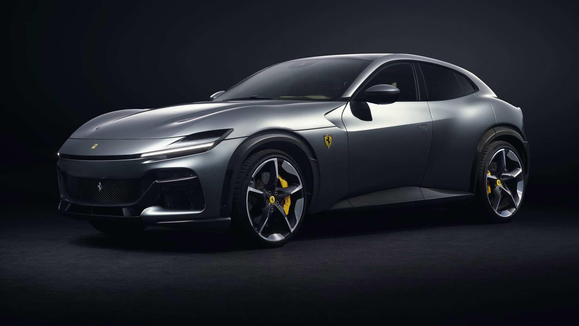Ferrari just revealed its first-ever 4-door model, a high-riding and powerful sports car called the Purosangue