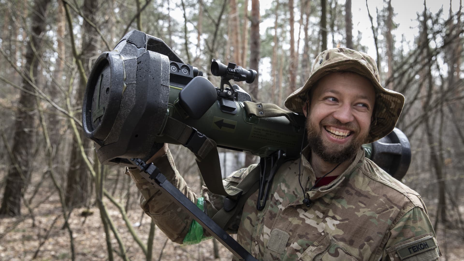 Oleg (31) smiles as he holds the MBT-NLAW (Next generation Light Anti-tank Weapon) provided by the United Kingdom.