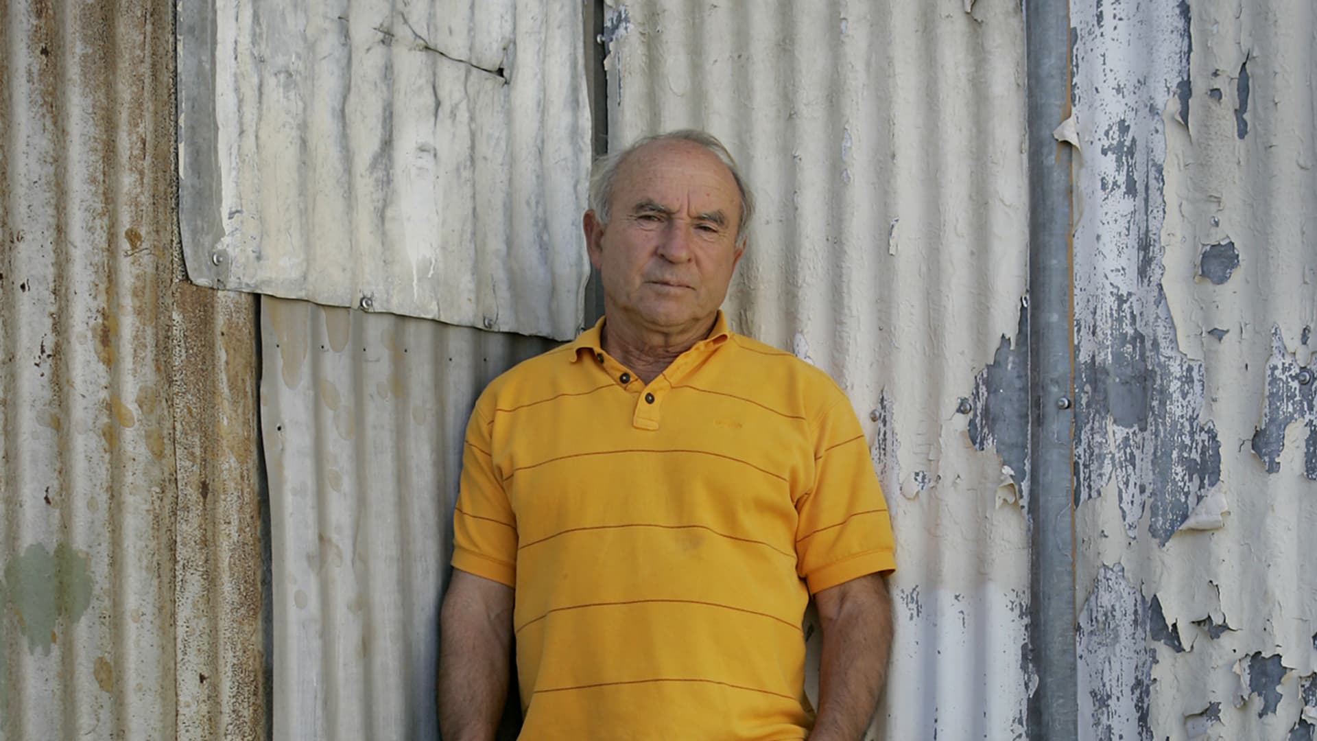 Yvon Chouinard, founder and owner of Patagonia, in front of a tin shed in Ventura, California, where he once forged pitons for mountaineers.