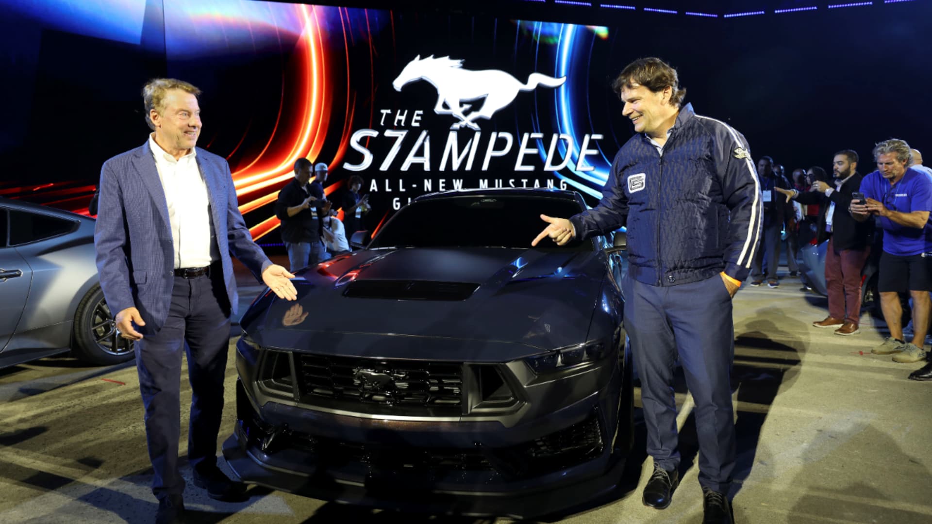 Ford Chair Bill Ford and President and CEO Jim Farley converse in front of newly revealed Mustang Dark Horse at The Stampede in downtown Detroit on Sept. 14, 2022.
