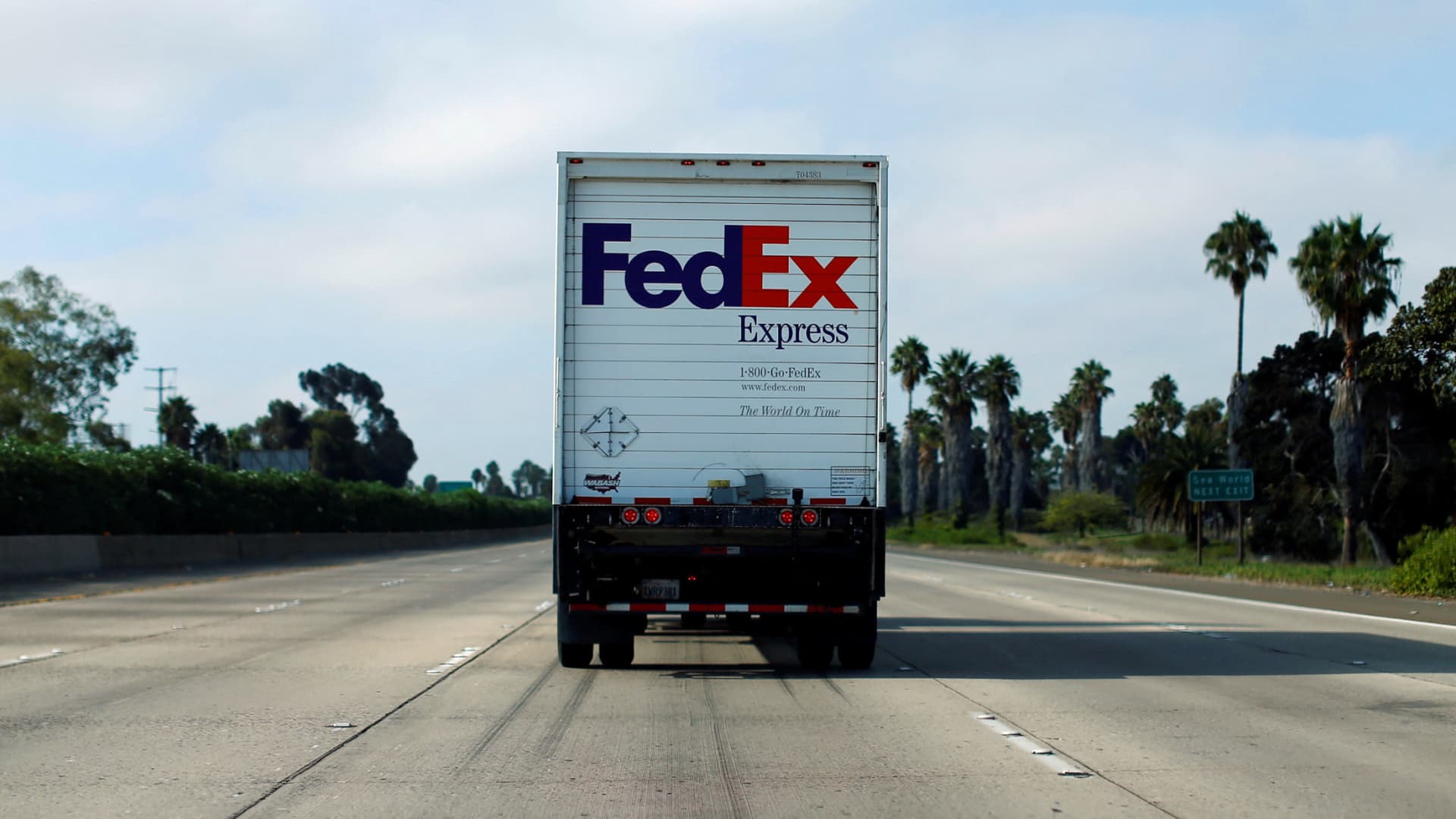 A Federal Express truck makes its way down a freeway in San Diego, California.