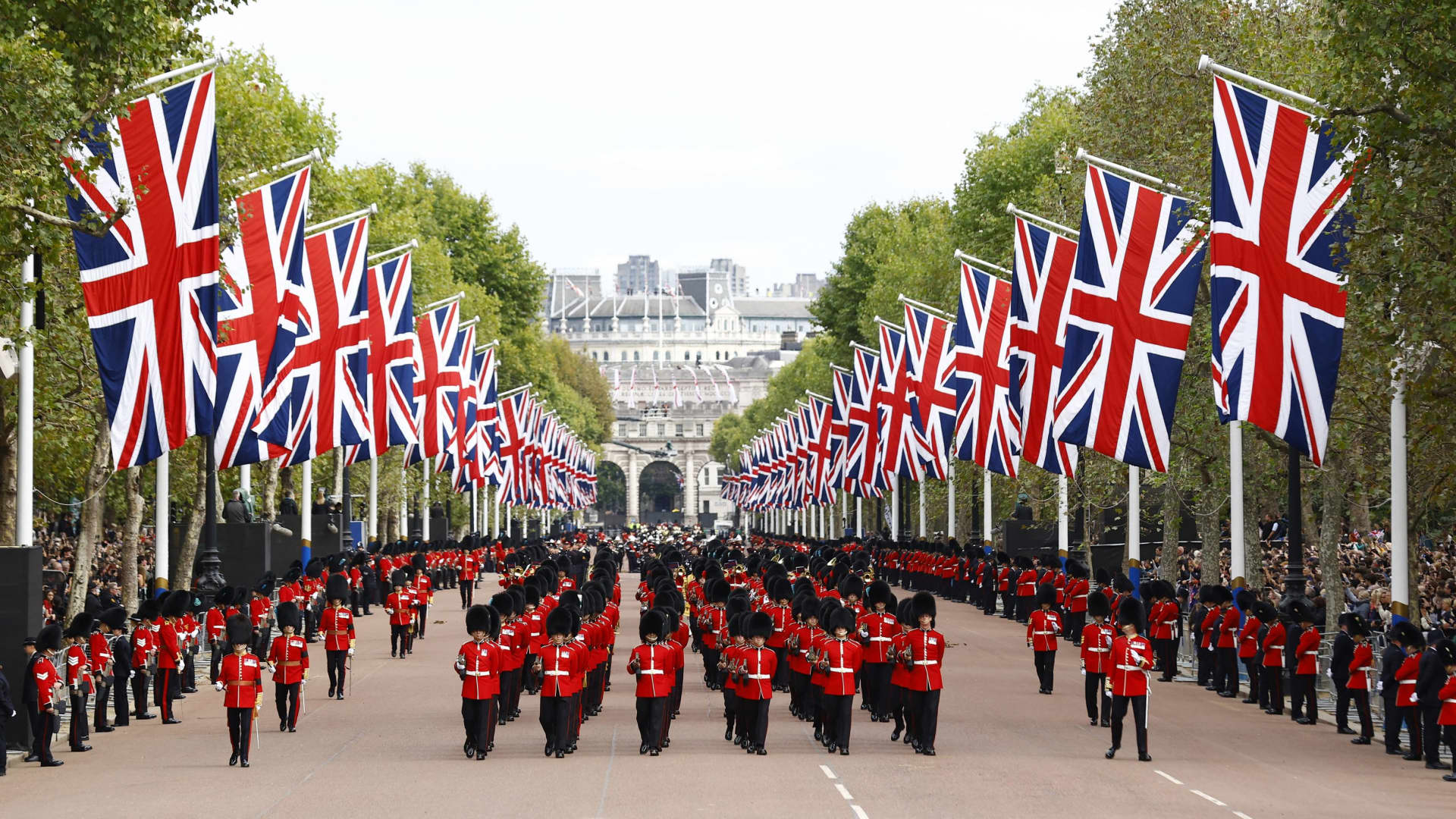 Royal guards march down The Mall during the funeral procession following the service at Westminster Abbey, on the day of the state funeral and burial of Britain's Queen Elizabeth, in London, Britain, September 19, 2022 