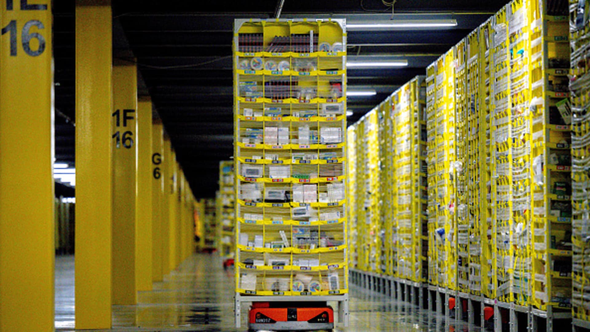 Robots transport goods to the employees in warehouse at Amazon fulfillment center in Eastvale on Tuesday, Aug. 31, 2021.