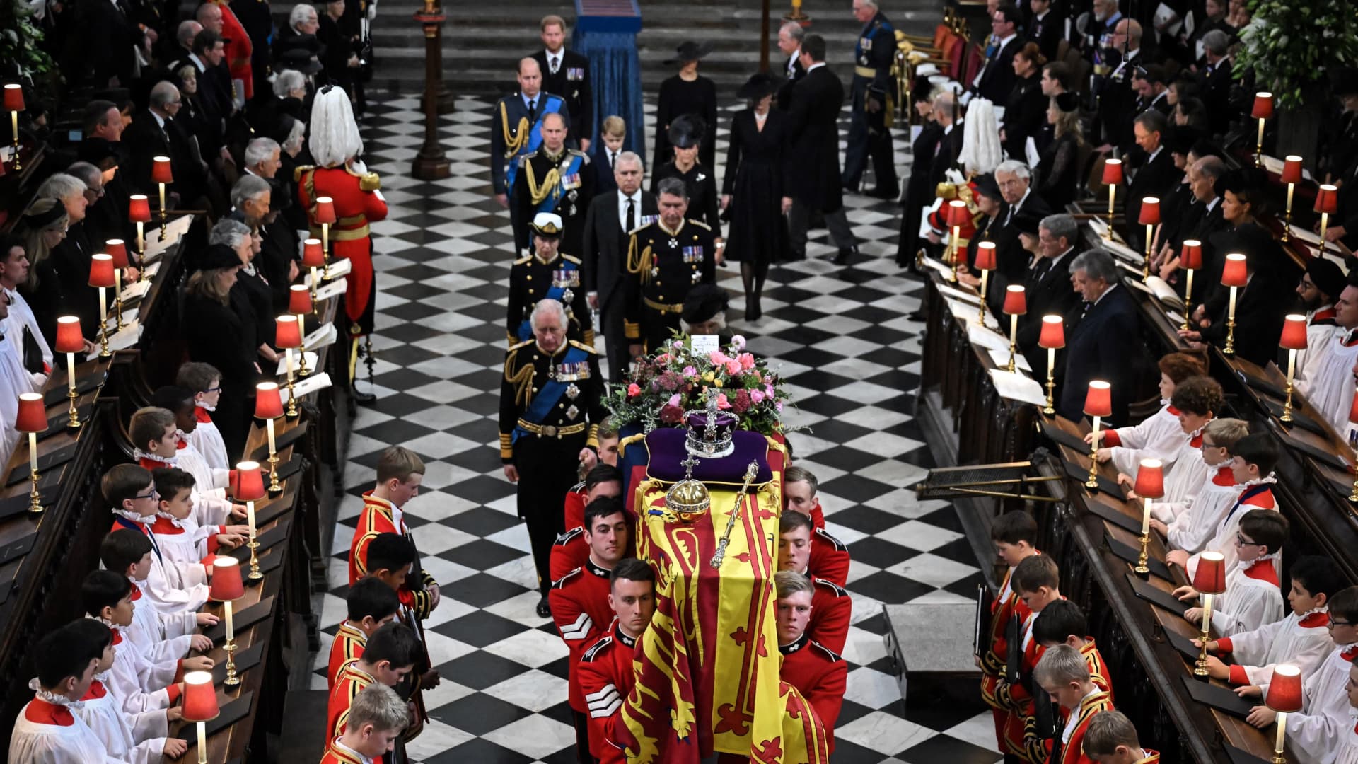 Britain's King Charles III (L), Britain's Camilla, Queen Consort, Britain's Princess Anne, Princess Royal, Vice Admiral Timothy Laurence, Britain's Prince Andrew, Duke of York, Britain's Prince Edward, Earl of Wessex, Britain's Sophie, Countess of Wessex, Britain's Prince William, Prince of Wales, Britain's Prince George of Wales, Britain's Catherine, Princess of Wales, Britain's Prince Harry, Duke of Sussex and Meghan, Duchess of Sussex walk behind the coffin of Britain's Queen Elizabeth II as they leave Westminster Abbey in London on September 19, 2022, after the State Funeral Service for Britain's Queen Elizabeth II.