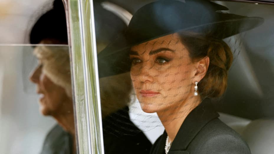 Britain's Catherine, Princess of Wales is seen in a car with Britain's Queen Camilla during the procession following the service, on the day of the state funeral and burial of Britain's Queen Elizabeth, in London, Britain, September 19, 2022 REUTERS/Peter Cziborra     TPX IMAGES OF THE DAY