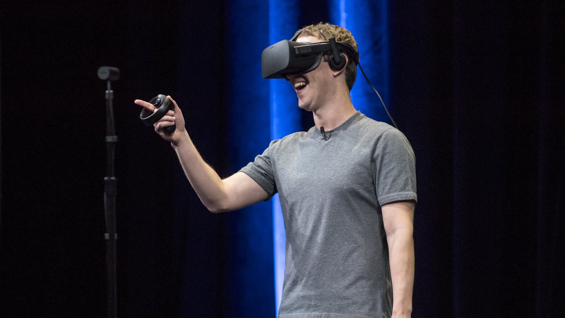 Meta CEO Mark Zuckerberg demonstrates an Oculus Rift virtual reality (VR) headset and Oculus Touch controllers during the Oculus Connect 3 event in San Jose, California, U.S., on Thursday, Oct. 6, 2016.