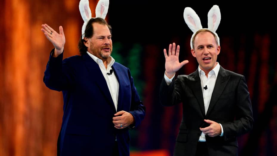 Bret Taylor, co-chief executive officer of Salesforce.com Inc., right, and Marc Benioff, co-chief executive officer of Salesforce.com Inc., wear rabbit ears during a keynote at the 2022 Dreamforce conference in San Francisco, California, US, on Tuesday, Sept. 20, 2022. Tens of thousands of techies will frolic through kitschy national park-themed decorations in San Francisco's downtown this week as Salesforce Inc.'s annual Dreamforce conference returns in full after two pandemic years. Photographer: Marle