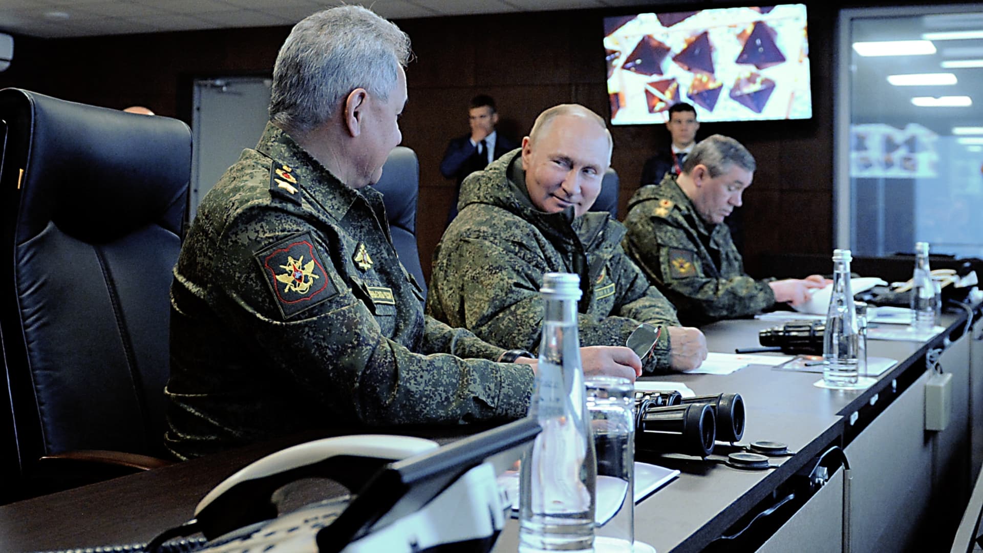 Russian President Vladimir Putin (C), accompanied by Defence Minister Sergei Shoigu (L) and Valery Gerasimov, the chief of the Russian General Staff, oversees the 'Vostok-2022' military exercises at the Sergeevskyi training ground outside the city of Ussuriysk on the Russian Far East on September 6, 2022.