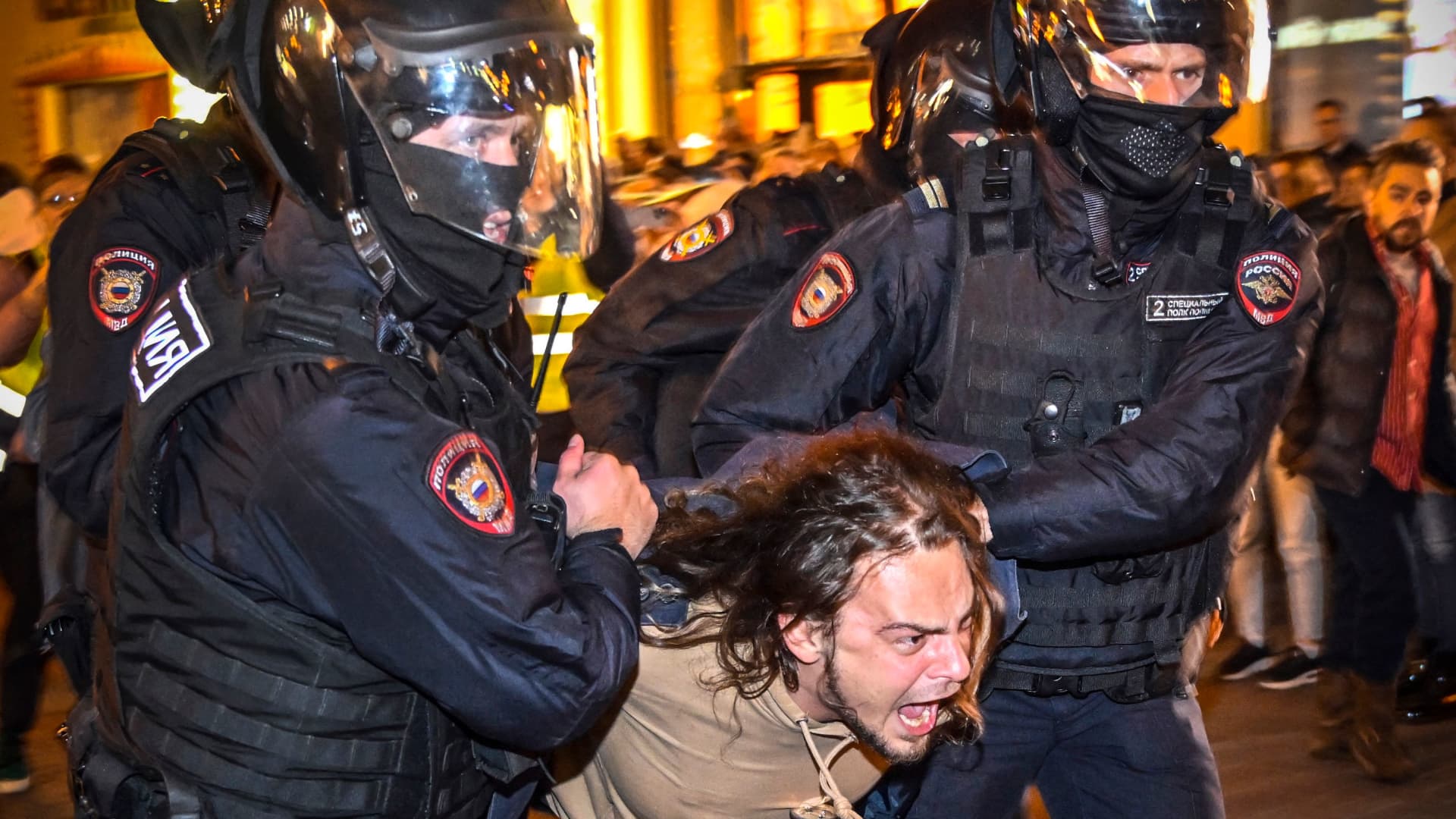Police officers detain a man following calls to protest against partial mobilisation announced by Russian President, in Moscow, on September 21, 2022.