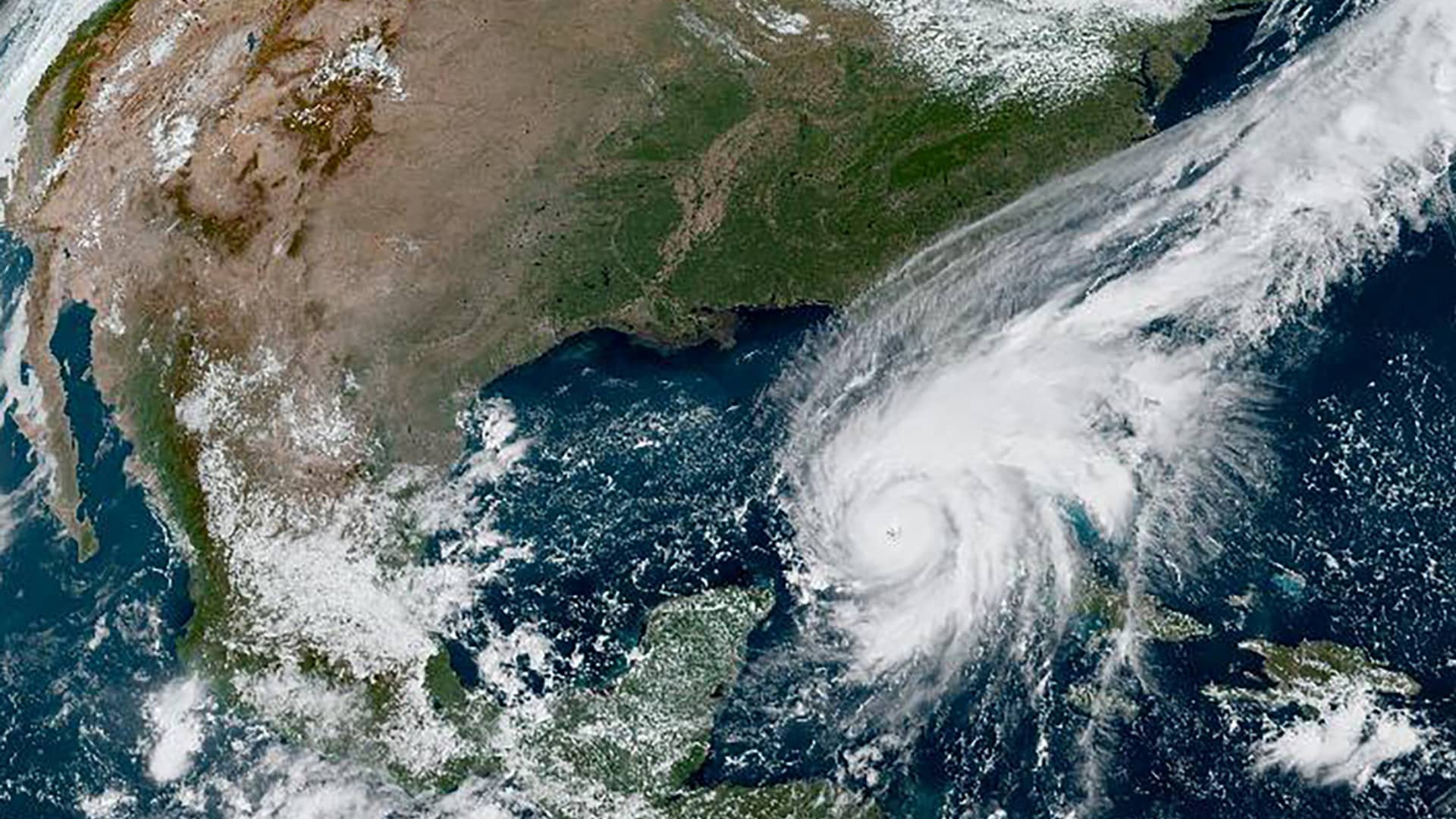 Hurricane Ian makes its way to Florida's west coast after passing Cuba in a composite image from the National Oceanic and Atmospheric Administration (NOAA) GOES-East weather satellite September 27, 2022.