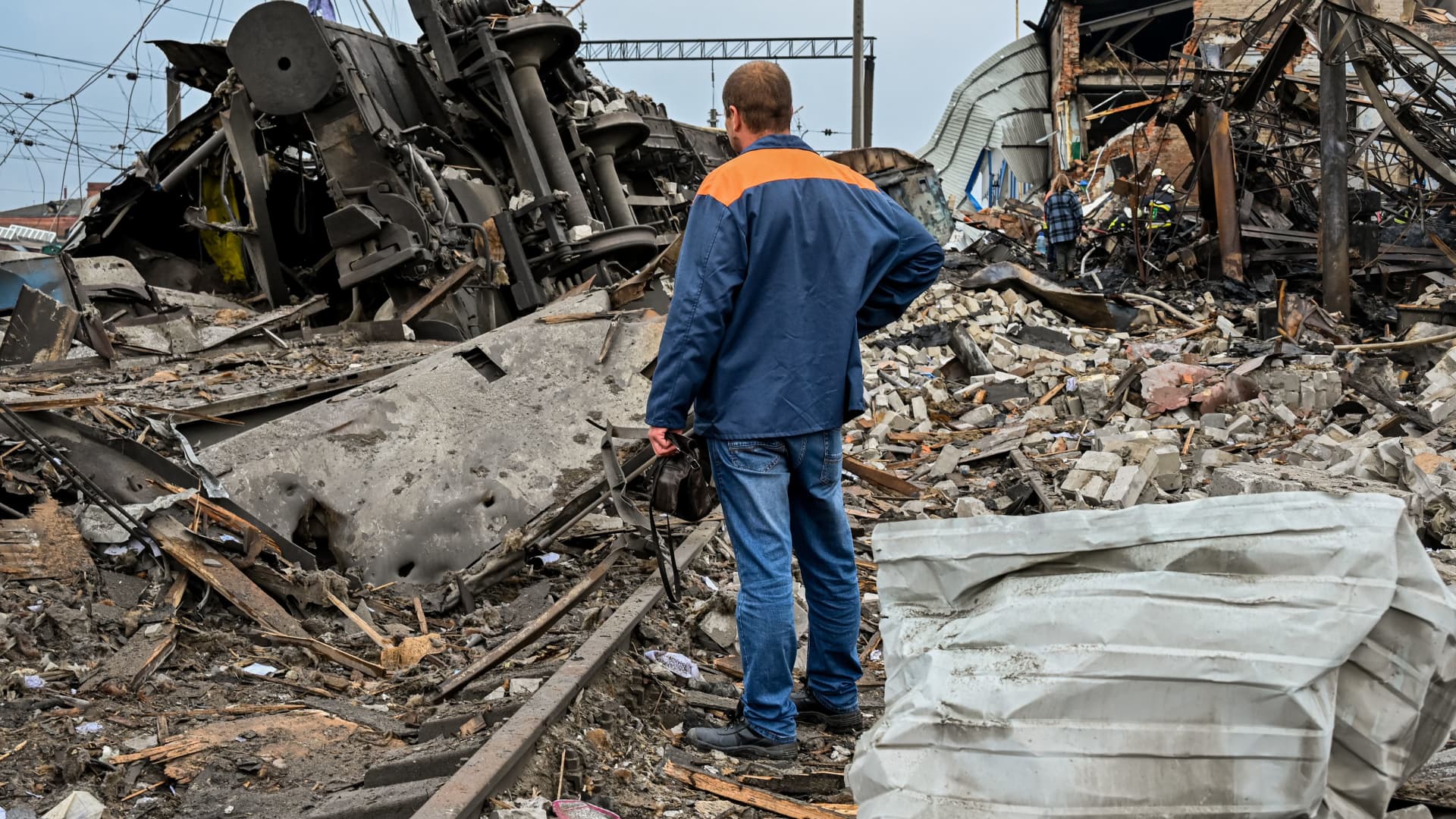 A worker inspects the damage near a railway yard of the freight railway station in Kharkiv, which was partially destroyed by a missile strike, amid the Russian invasion of Ukraine on September 28, 2022. 