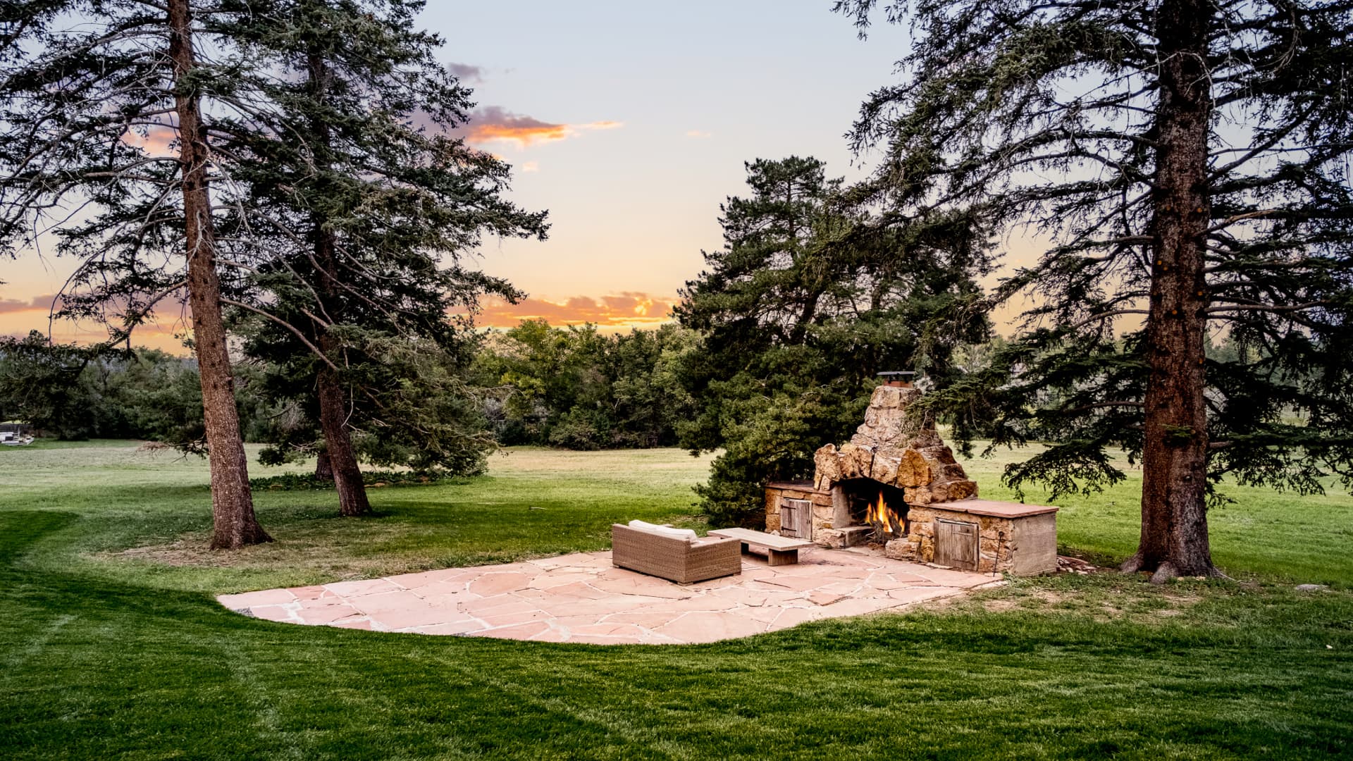 Outdoor stone fireplace and patio.