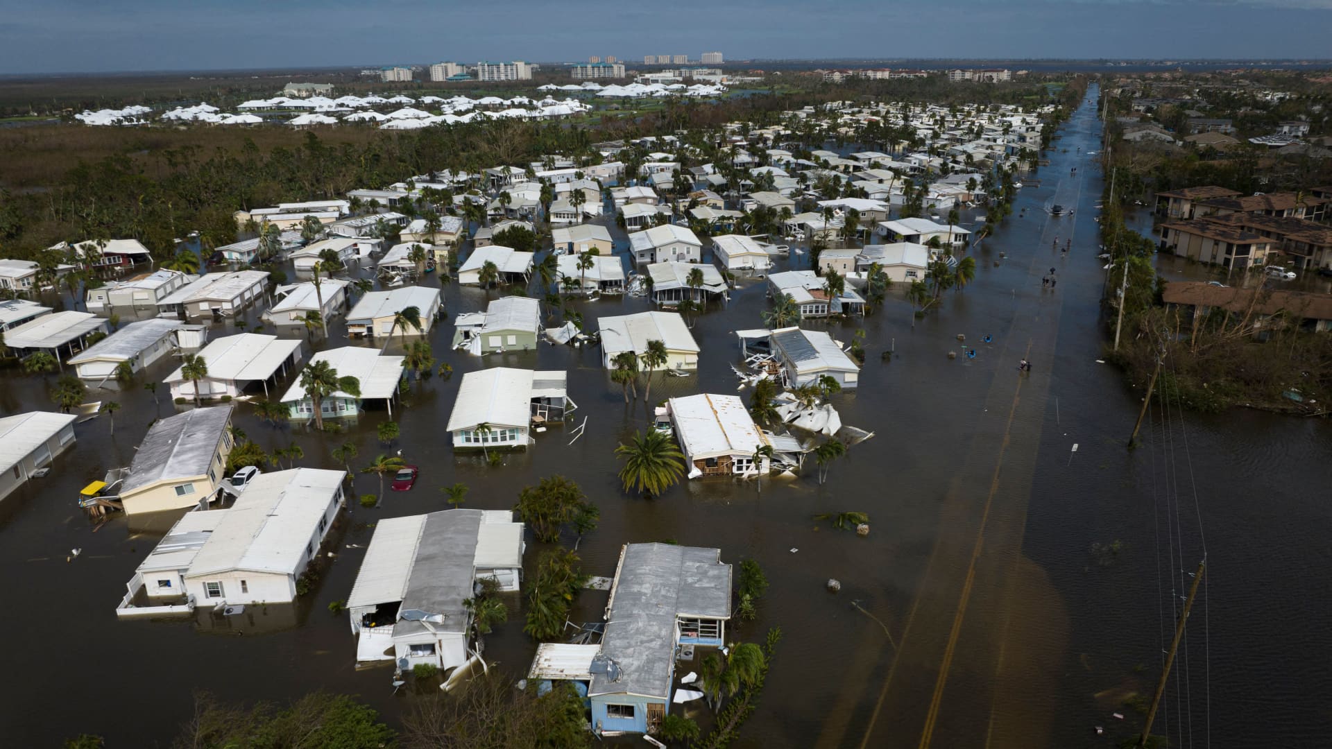 An aerial picture taken on September 29, 2022 shows a flooded neighborhood in the aftermath of Hurricane Ian in Fort Myers, Florida.