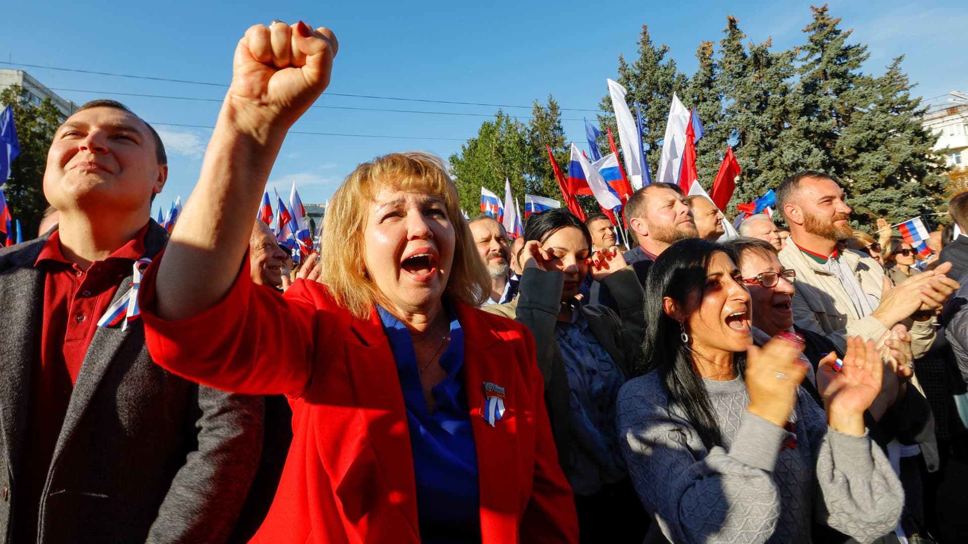 People attend an event marking the declared Russia's annexation of the Russian-controlled territories of four Ukraine's Donetsk, Luhansk, Kherson and Zaporizhzhia regions, after holding what Russian authorities called referendums in the occupied areas of Ukraine that were condemned by Kyiv and governments worldwide, in Luhansk, Russian-controlled Ukraine, September 30, 2022.