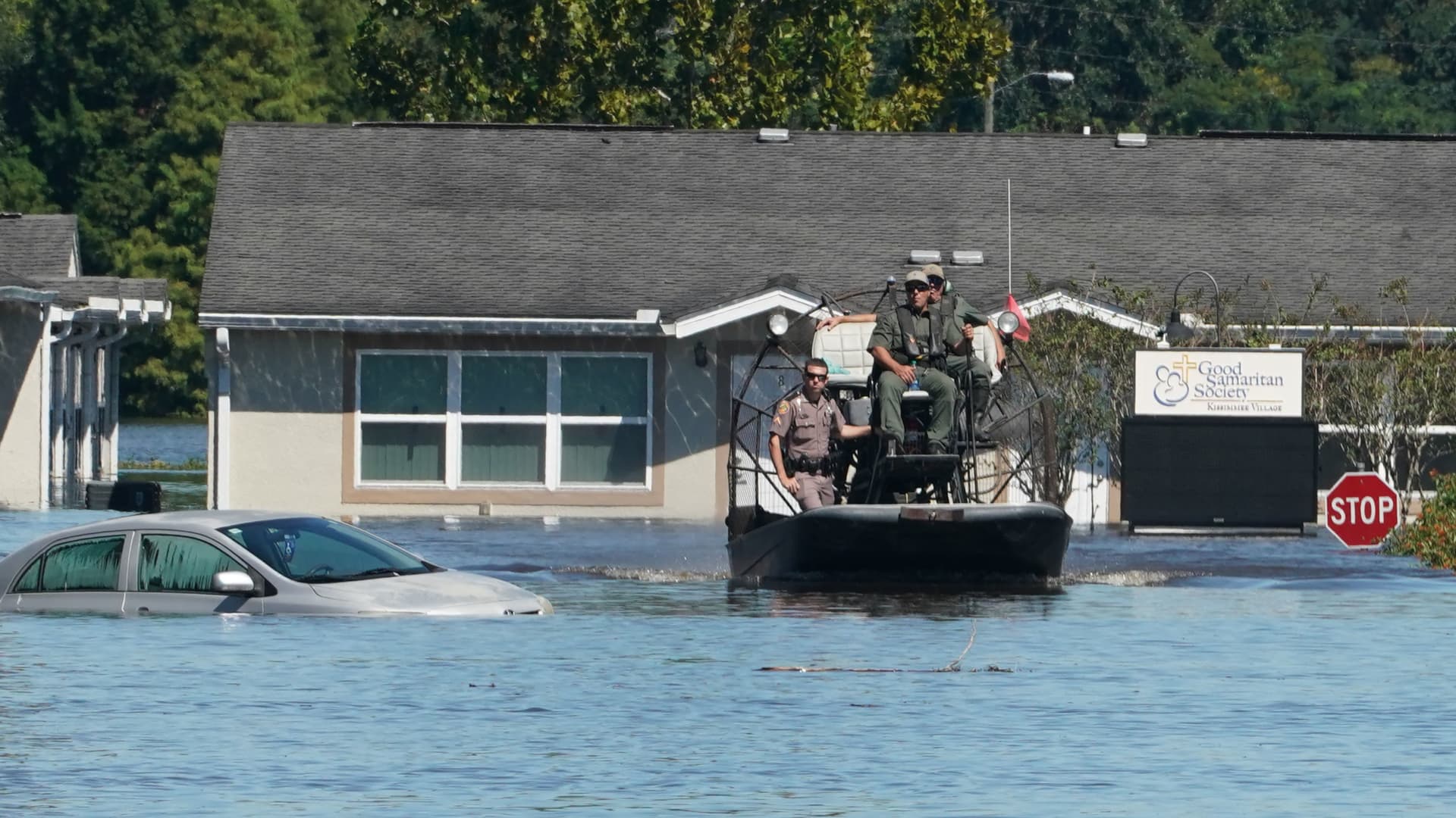 Osceola County Sheriffs use a fanboat as they urge residents to leave the flooded Good Samaritan Society Village, following Hurricane Ian on September 30, 2022 in Kissimmee, Florida.