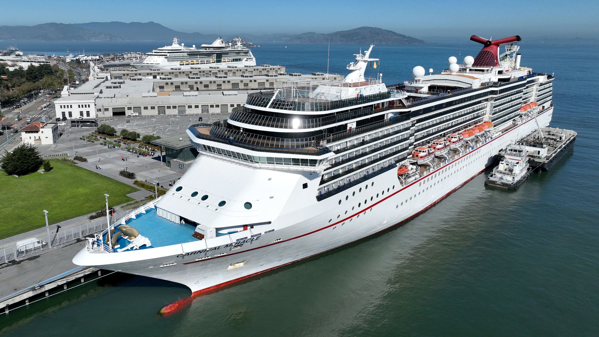 In an aerial view, the Carnival Miracle cruise ship operated by Carnival Cruise Line sits docked at Pier 27 in San Francisco on Sept. 30, 2022.