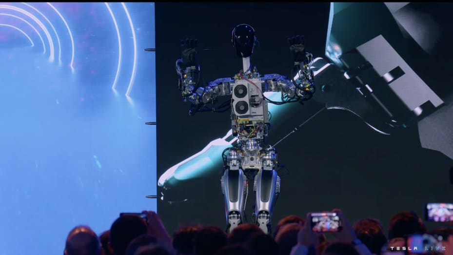 Tesla shows off a prototype of its humanoid robot at 2022 AI Day on Sept. 30.