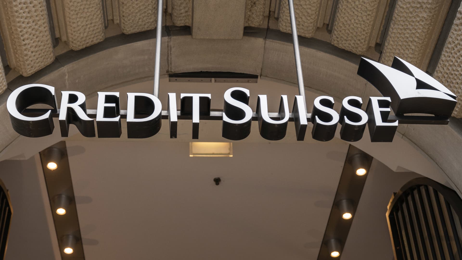 Credit Suisse to buy back $3 billion in debt, sell landmark hotel as credit fear..