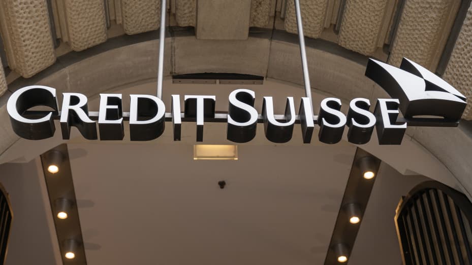 Signage hangs over the entrance of a Credit Suisse Group AG branch in Zurich, Switzerland, on Sunday, Sept. 25, 2022. Inflation in Switzerland has more than doubled since the start of the year and the State Secretariat for Economic Affairs expects it to come in at a three-decade-high of 3% for 2022. Photographer: Pascal Mora/Bloomberg via Getty Images