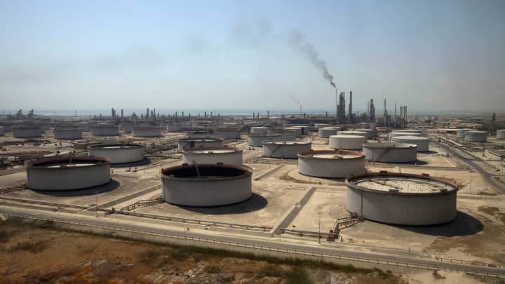 Crude oil storage tanks at the Juaymah Tank Farm in Saudi Aramco's Ras Tanura oil refinery and oil terminal in 2018. Crude prices fluctuated in recent months, rising to more than $120 in early June amid growing fears about a global recession, subsequently falling to around $90 per barrel after OPEC+ slashed production.