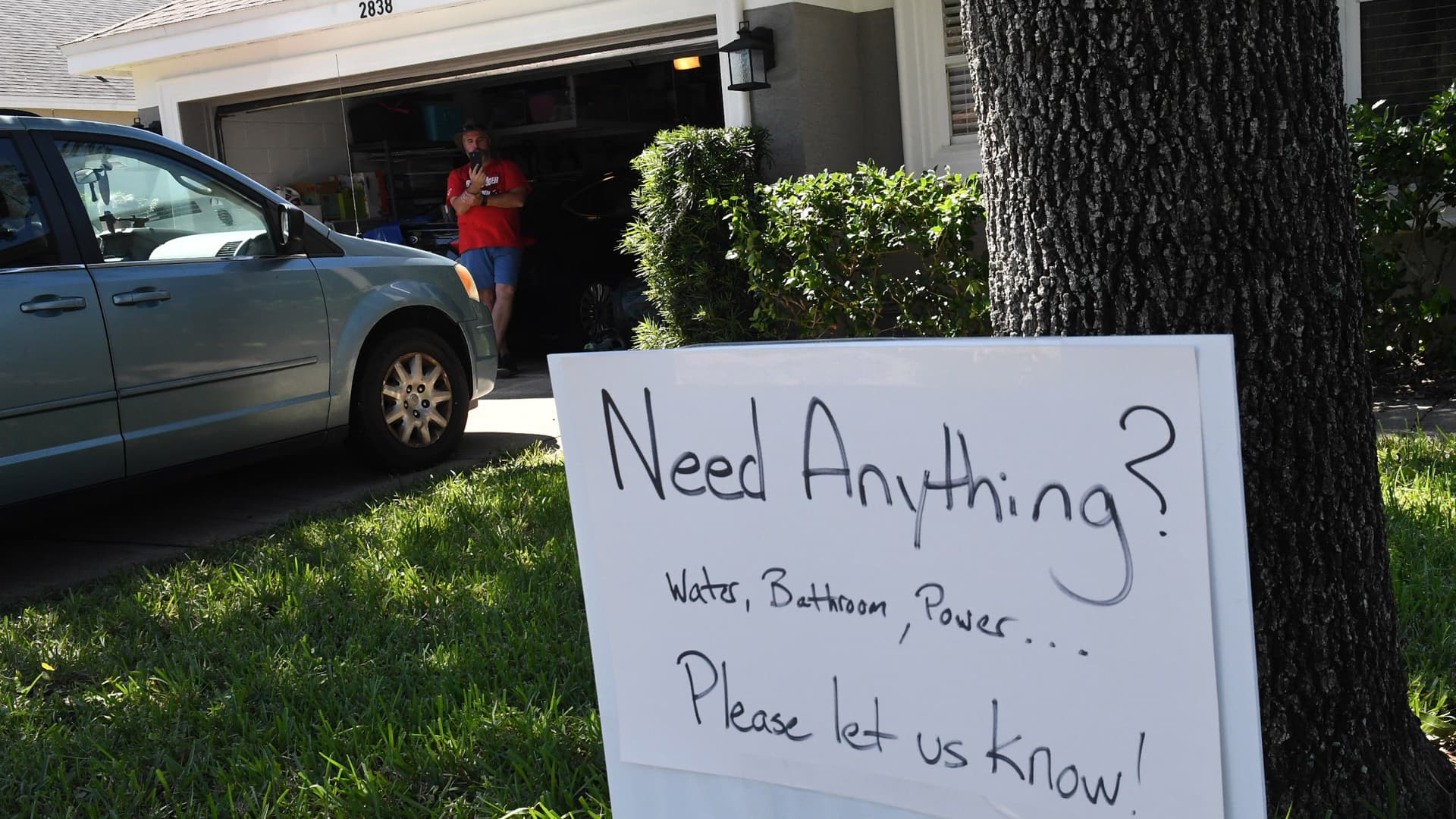 A sign on Chris Bartonâs lawn offers assistance to his neighbors whose homes were flooded by rain from Hurricane Ian on October 1, 2022 in Orlando, Florida.