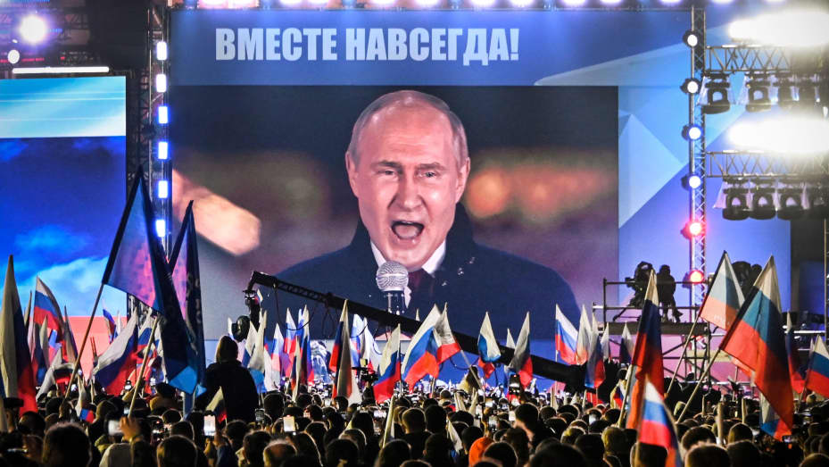 Russian President Vladimir Putin on a screen at Red Square as he addresses a rally and a concert marking the annexation of four regions of Ukraine — Luhansk, Donetsk, Kherson and Zaporizhzhia — in central Moscow on Sept. 30, 2022.