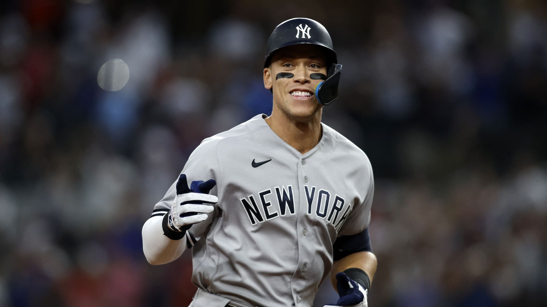 New York Yankees right fielder Aaron Judge (99) rounds the bases after hitting home run number sixty-two to break the American League home run record in the first inning against the Texas Rangers at Globe Life Field.