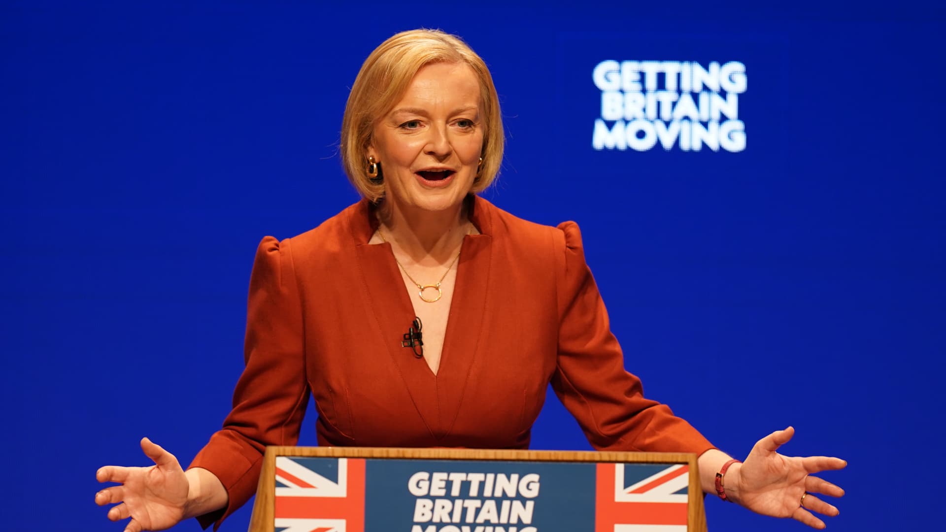 UK’s Liz Truss pledges tax-cutting future in landmark speech plagued by protest and political infighting – CNBC